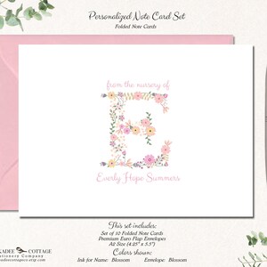May include: A personalized note card set with a pink envelope. The card features a floral letter "E" with the text "from the nursery of Everly Hope Summers". The set includes 10 folded note cards.
