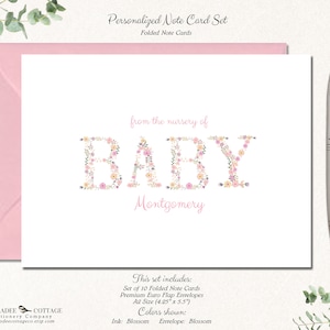 May include: A set of 10 folded note cards with floral lettering that spells out "BABY" and the name "Montgomery". The cards are pink and white with a floral design. The set includes premium Euro flap envelopes in A2 size (4.25" x 5.5").