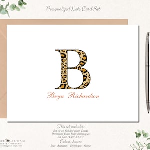 May include: Personalized note card set with a leopard print letter B and the name Bryn Richardson. The set includes 10 folded note cards and premium euro flap envelopes in A2 size (4.25" x 5.5"). The ink color is autumn and the envelope color is stone.