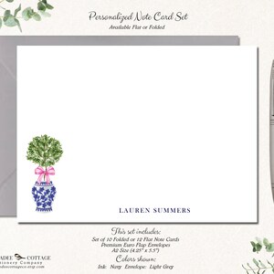 May include: Personalized note card set with a watercolor illustration of a potted tree with a pink ribbon. The card set includes 10 folded or 12 flat note cards and premium euro flap envelopes. The cards are A2 size (4.25" x 5.5"). The ink color is navy and the envelope color is light grey. The text on the card reads "LAUREN SUMMERS".