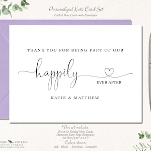May include: A personalized note card set with a lavender envelope. The card reads "Thank you for being part of our happily ever after" with the names Katie & Matthew. A silver pen rests on the right. The set includes 10 folded cards.