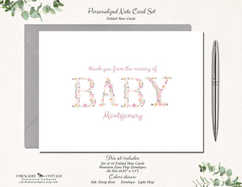 May include: A set of 10 folded note cards with floral lettering that says "thank you from the nursery of BABY Montgomery". The cards are A2 size (4.25" x 5.5") and come with dusty rose ink and light grey envelopes.