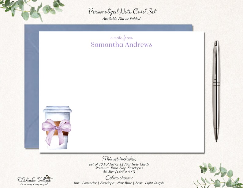 May include: A set of 10 folded or 12 flat note cards with matching envelopes. The cards feature a watercolour illustration of a coffee cup with a purple bow. The text "a note from Samantha Andrews" is printed at the top of the card. The card set is available in lavender ink, new blue envelopes, and a light purple bow.