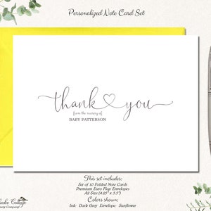 May include: A personalized note card set with a white card featuring the words "thank you" in elegant script, with "from the nursery of BABY PATTERSON" below. The card is set against a bright yellow envelope, with a silver pen and greenery. The set includes 10 folded cards.