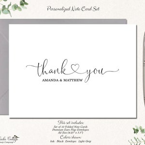 May include: A white note card with the words "thank you" in elegant script, with the names "AMANDA & MATTHEW" below. The card is accompanied by a gray envelope and a silver pen. The set includes 10 folded cards, A2 size (4.25" x 5.5").