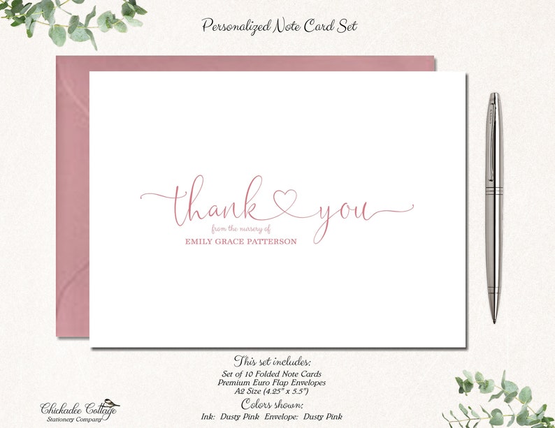 May include: A set of 10 folded note cards with dusty pink envelopes. The cards are A2 size (10.8 cm x 14 cm) and feature the text "thank you" with a heart symbol and the words "from the memory of" followed by a name. The text is in a cursive font and is printed in dusty pink ink.