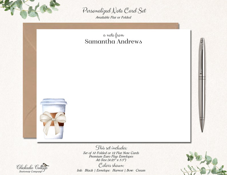 May include: A set of 10 folded or 12 flat note cards with envelopes. The cards feature a watercolour illustration of a coffee cup with a brown ribbon. The text "a note from Samantha Andrews" is printed at the top of the card. The card size is 4.25 inches by 5.5 inches. The ink colour is black, the envelope colour is harvest, and the bow colour is cream.