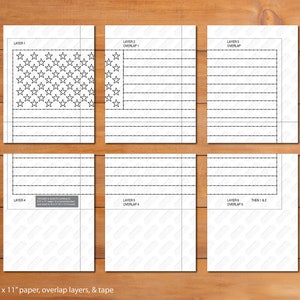 May include: Six printable sheets with black lines outlining the American flag. The first sheet has stars, the rest have stripes. Print on 8.5 x 11 inch paper, overlap layers, and tape.
