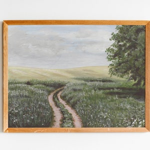 May include: A painting of a winding dirt road leading through a field of green grass and white wildflowers. A single tree stands on the right side of the road, with a cloudy sky in the background.