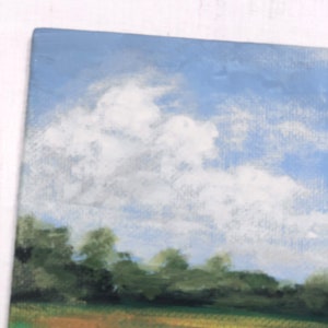 May include: A painting depicting a landscape with a field of green grass and a blue sky with white clouds. The field is in the foreground and the sky is in the background. There are trees in the middle ground.