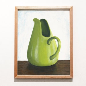 May include: A painting of a bright green ceramic pitcher with a rounded body and a curved handle. The pitcher is sitting on a wooden surface.