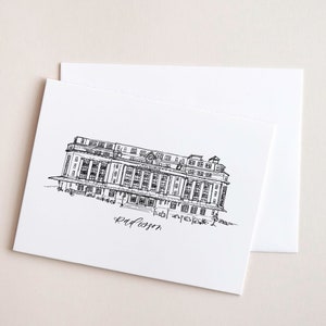 May include: Black and white line drawing of a building with the text "Hotel Majestic" and "Radisson" written below.