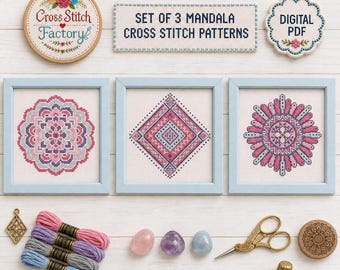 May include: A set of three mandala cross stitch patterns in light blue frames, accompanied by a wooden embroidery hoop, a digital PDF label, four skeins of embroidery floss, three polished stones, gold scissors, a thimble, and a charm.