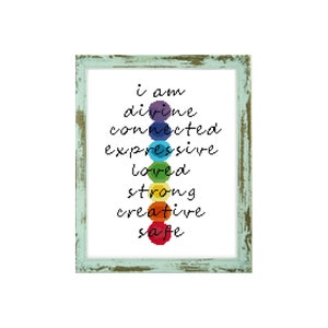 May include: A framed print with a rainbow of circles and the text "i am divine connected expressive loved strong creative safe".