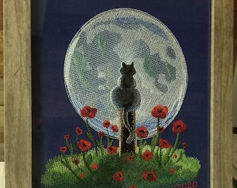 Embroidered picture of cat looking at the moon