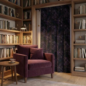Masculine living room with dark woods and a deep purple raven blackout curtain, crisp details of ravens and foliage shown in soft highlights
