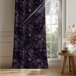 Dark whimsical raven blackout curtain in a contemporary living room, purple and black botanical details visible in bright natural window light