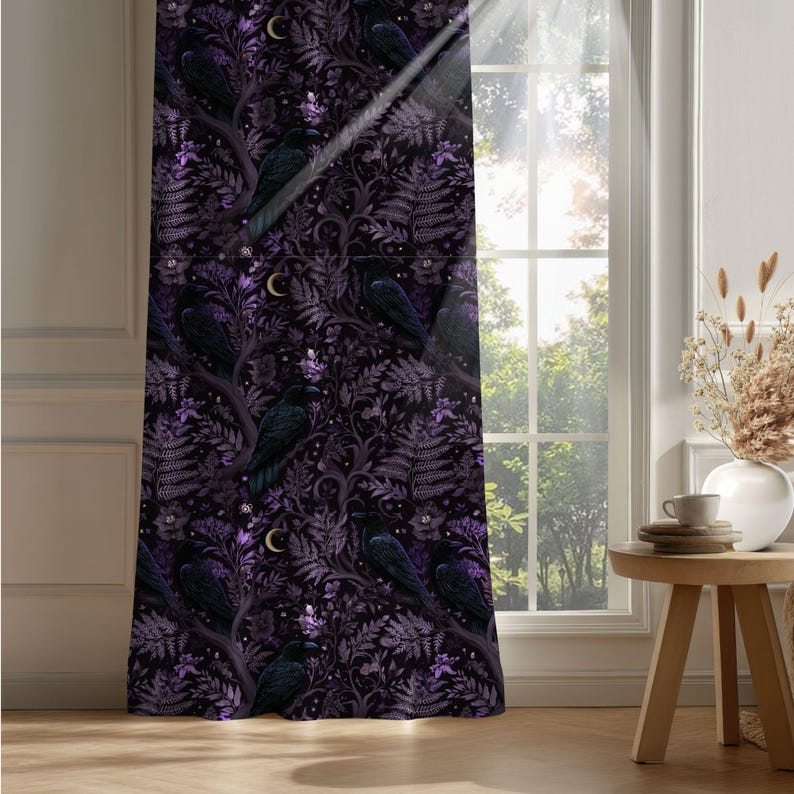 Dark whimsical raven blackout curtain in a contemporary living room, purple and black botanical details visible in bright natural window light
