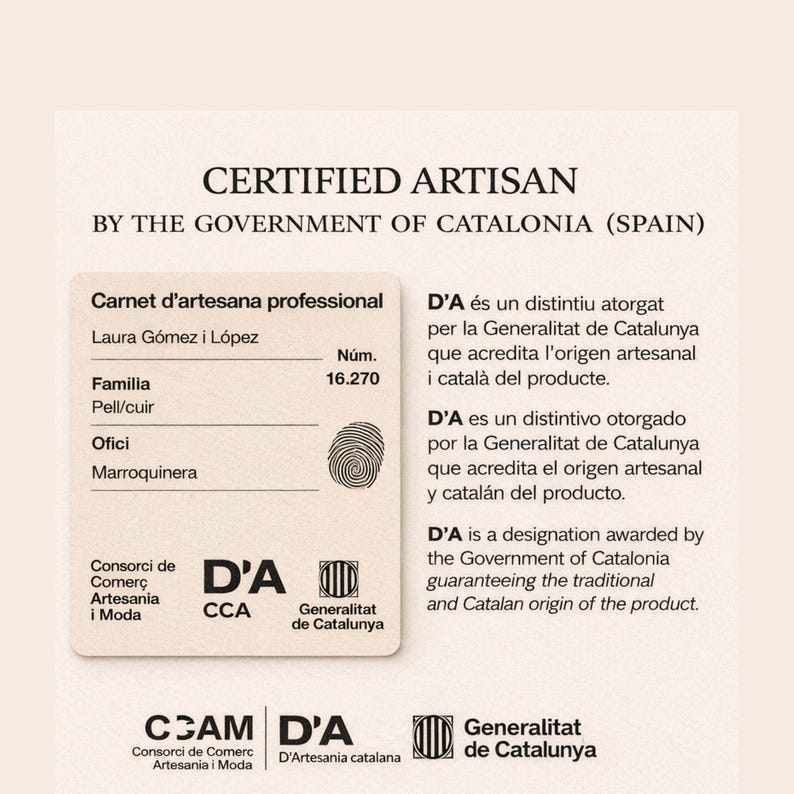 May include: A cream-colored official document titled CERTIFIED ARTISAN BY THE GOVERNMENT OF CATALONIA (SPAIN). It displays the text Carnet d'artesana professional, Laura G&oacute;mez i L&oacute;pez, number 16.270, Pell/cuir, Marroquinera, and a fingerprint icon.
