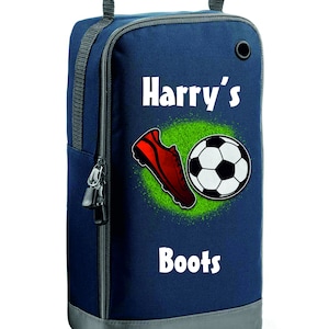 May include: A blue and grey sports shoe bag with a zip closure. The bag features a white graphic of a football and a red football boot on a green pitch. The text "Harry's Boots" is printed on the bag.