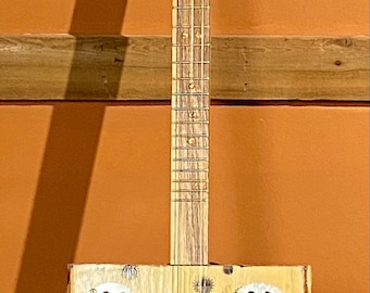 Perfectos.  Hand Crafted Cigar Box Guitar