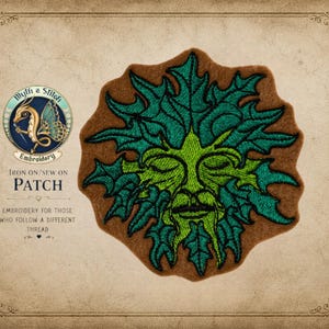 May include: An embroidered patch featuring a Green Man design with a face surrounded by green leaves. The patch is on a brown background. The text "Myth & Stitch Embroidery" and "Iron On/Sew On Patch" are also visible.