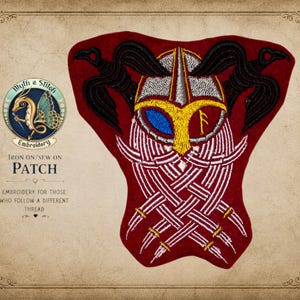 May include: A red embroidered patch featuring a Viking helmet design with black raven wings. The patch includes the text "Wyth a Stitch Embroidery" and "Iron On/Sew On Patch". The design incorporates white, gold, and blue details.