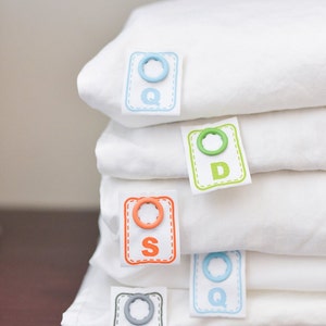 Simple to attach snap on labels that tell you the size of sheets and other bed linens for easy bed making. image 1