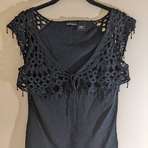 Black tank top with overlay crochet and beads