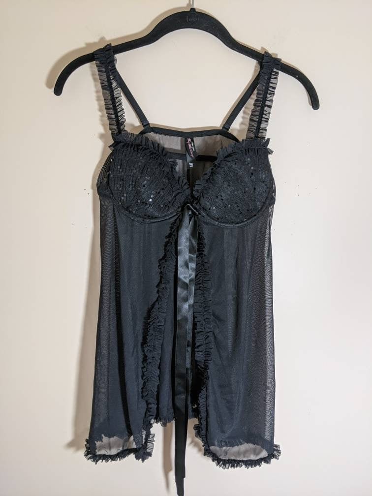 victoria secret sexy little things lingerie Middle age hispanic woman wearing lingerie suffering for stomach ache lying  on bed at bedroom main image 0
