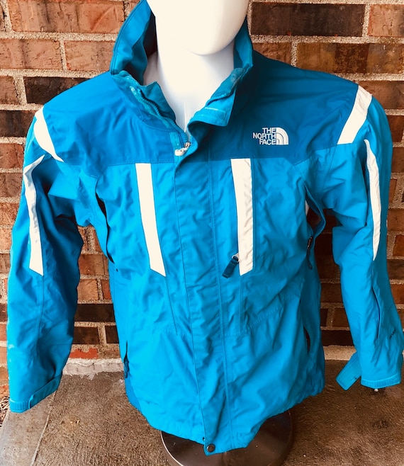 blue and white north face jacket