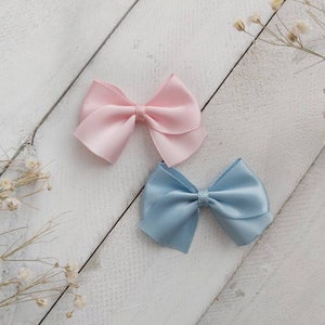 light pink and blue polyester dog bow with non latex groomer bands, pair of dog bows, pink dog hair bow, gummiband, small bow for dog,