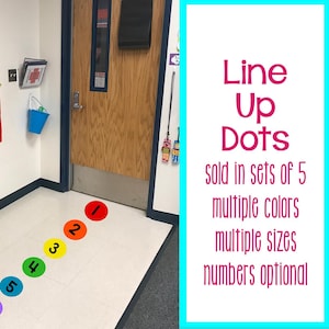 May include: A set of circular floor decals in red, orange, yellow, green, blue, purple, and red, each featuring a black number. The text on the right reads: Line Up Dots, sold in sets of 5, multiple colors, multiple sizes, numbers optional.