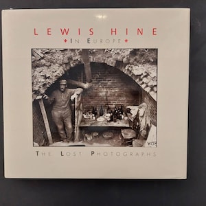 May include: A book cover with a black and white photo of a man standing in a brick doorway. The book title is "Lewis Hine + In Europe + The Lost Photographs".