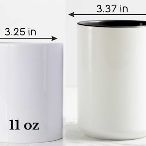 May include: White ceramic mug with a black rim and handle. The mug is 3.25 inches wide, 3.75 inches tall, and 4.62 inches from handle to handle. It holds 11 ounces.