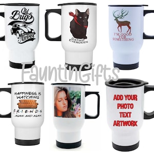 May include: White travel mugs with black handles and lids. Designs include a vintage car with "Old Bugs Never", a black cat with "Catnip Everdeen", a deer with "I'm Good For Something", a Friends quote, a photo, and a customizable design.