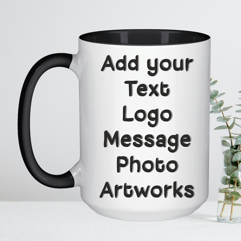 May include: White ceramic mug with a black rim and handle. The mug has black text that reads "Add your Text Logo Message Photo Artworks".