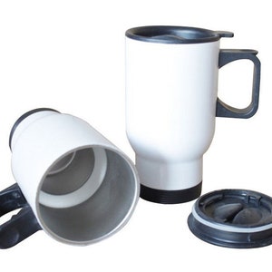 May include: White travel mugs with black handles and lids. One mug is upright, another is on its side, and the lid is separate. The mugs are designed to keep beverages hot or cold. The mugs are approximately 6 inches tall.