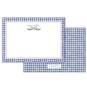 May include: Blue and white gingham stationery with a blue bow and red hearts. The stationery has the text "mrs. miller" printed on it. The bottom of the stationery has the text "LULUBEE PAPER CO."