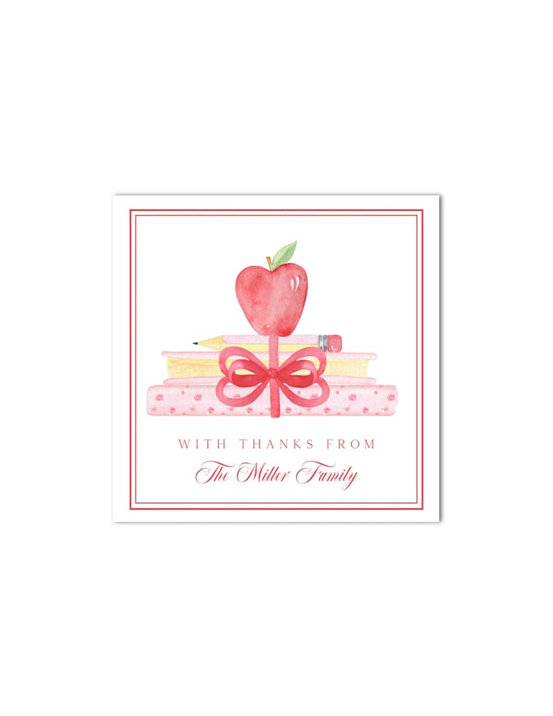 May include: A pink and red teacher appreciation gift tag with a red apple, pencils, and books. The tag says "With thanks from The Miller Family".