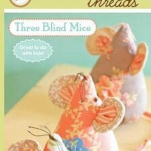 May include: Three fabric mice with large, patterned ears and long tails. The mice are made of floral and patterned fabrics in shades of pink, orange, and white. The text "Three Blind Mice" is visible in the image.