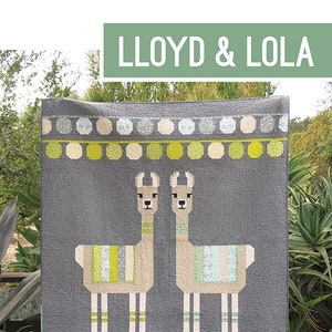 May include: A gray quilt featuring two llama figures with patterned details. The quilt has a border of green and cream-colored geometric shapes. The text "LLOYD & LOLA" is at the top. The pattern is by Elizabeth Hartman.
