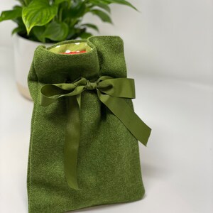 Tweed-covered hot water bottles in solid colours