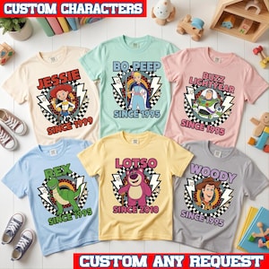 May include: Six short-sleeved t-shirts in cream, light green, pink, light blue, yellow, and gray. Each shirt features a character graphic with a checkered circle, lightning bolts, and text including Jessie Since 1999, Bo Peep Since 1995, Buzz Lightyear Since 1995, Rex Since 1995, Lotso Since 2010, and Woody Since 1995.
