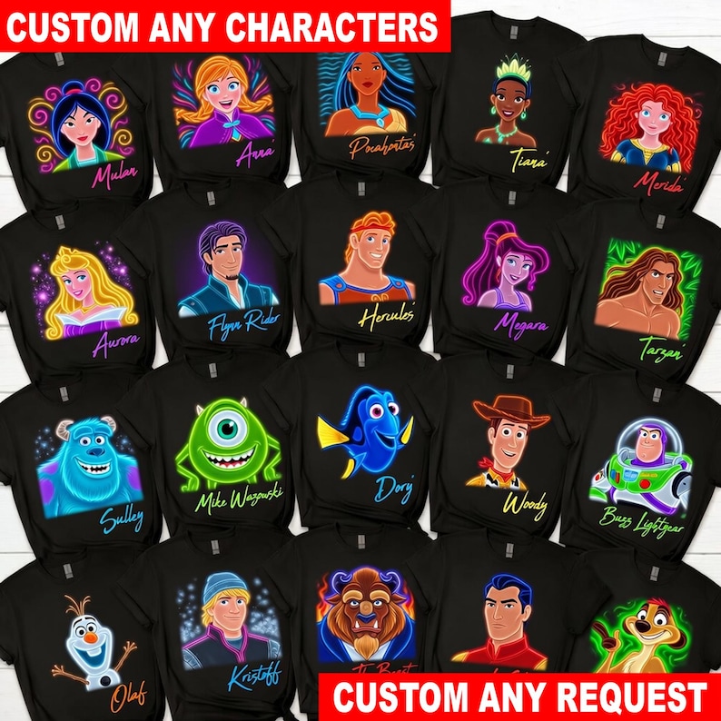May include: A collection of black t-shirts featuring various animated characters including Mulan, Anna, Pocahontas, Tiana, Merida, Aurora, Flynn Rider, Hercules, Megara, Tarzan, Sulley, Mike Wazowski, Dory, Woody, Buzz Lightyear, Olaf, Kristoff, Beast, Li Shang, and Timon.