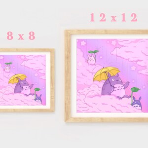 May include: Two framed prints of a cartoon character with a yellow umbrella in a pink and purple cloudy sky. The larger print is 12x12 inches and the smaller print is 8x8 inches.