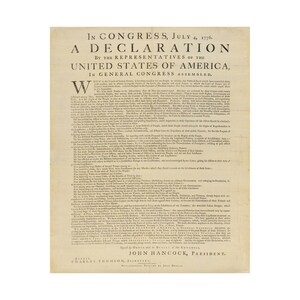 May include: A printed document titled In Congress, July 4, 1776, A Declaration by the Representatives of the United States of America, in General Congress Assembled. The text is black on a light beige paper, featuring the signature of John Hancock.
