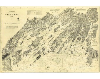 May include: A vintage U.S. Coast Survey nautical chart of Casco Bay, Maine, printed in black ink on a cream-colored background. The map features detailed topography, numerous islands, depth soundings, compass roses, and technical legends.