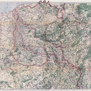 May include: A vintage map of the Western Front during World War I. The map shows the battle lines and key locations in France and Belgium. The map is printed in black and white with red lines indicating the front lines.