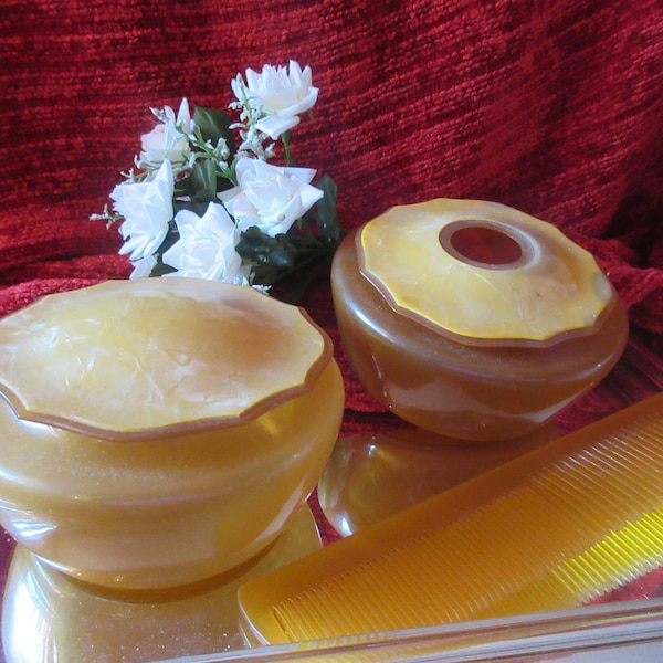 1930's art deco vanity set, covered trinket, hair receiver and comb,  marbleized celluloid tops, clear and frosted butterscotch bottoms